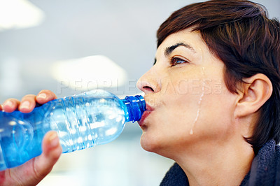 Buy stock photo Closeup of fitness woman drinking water after workout