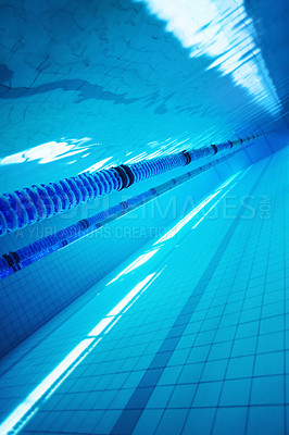 Buy stock photo Underwater image of a blue swimming pool with lane markers