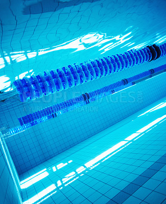 Buy stock photo Underwater image of a blue swimming pool with lane markers