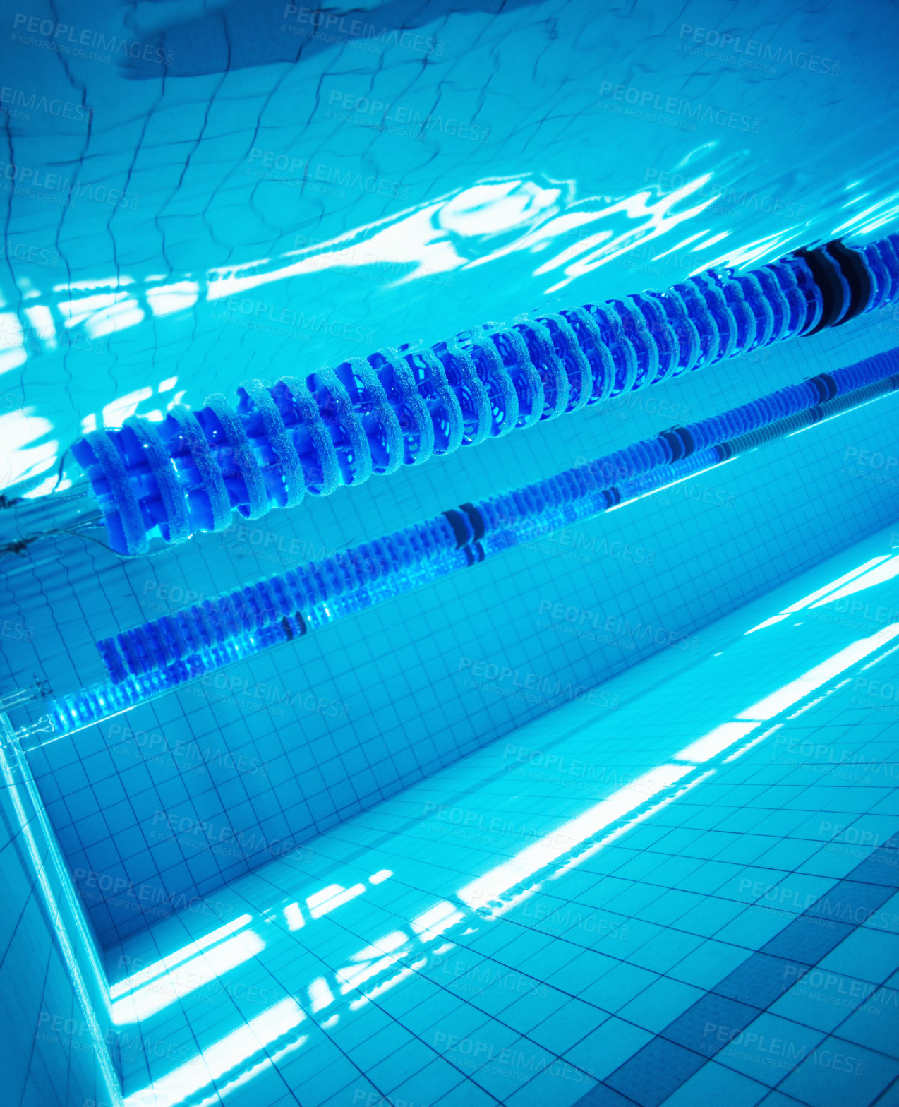 Buy stock photo Underwater image of a blue swimming pool with lane markers