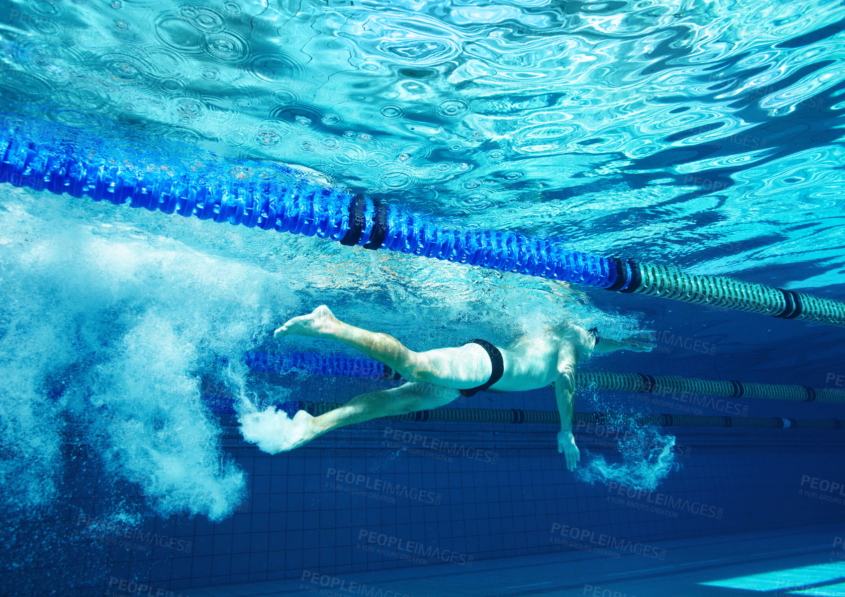 Buy stock photo Underwater, race and person in pool, swimming and training for competition, blue and athlete. Lines, clean and aquatic sports for exercise, recreational and liquid for cardio, rope or arena for games
