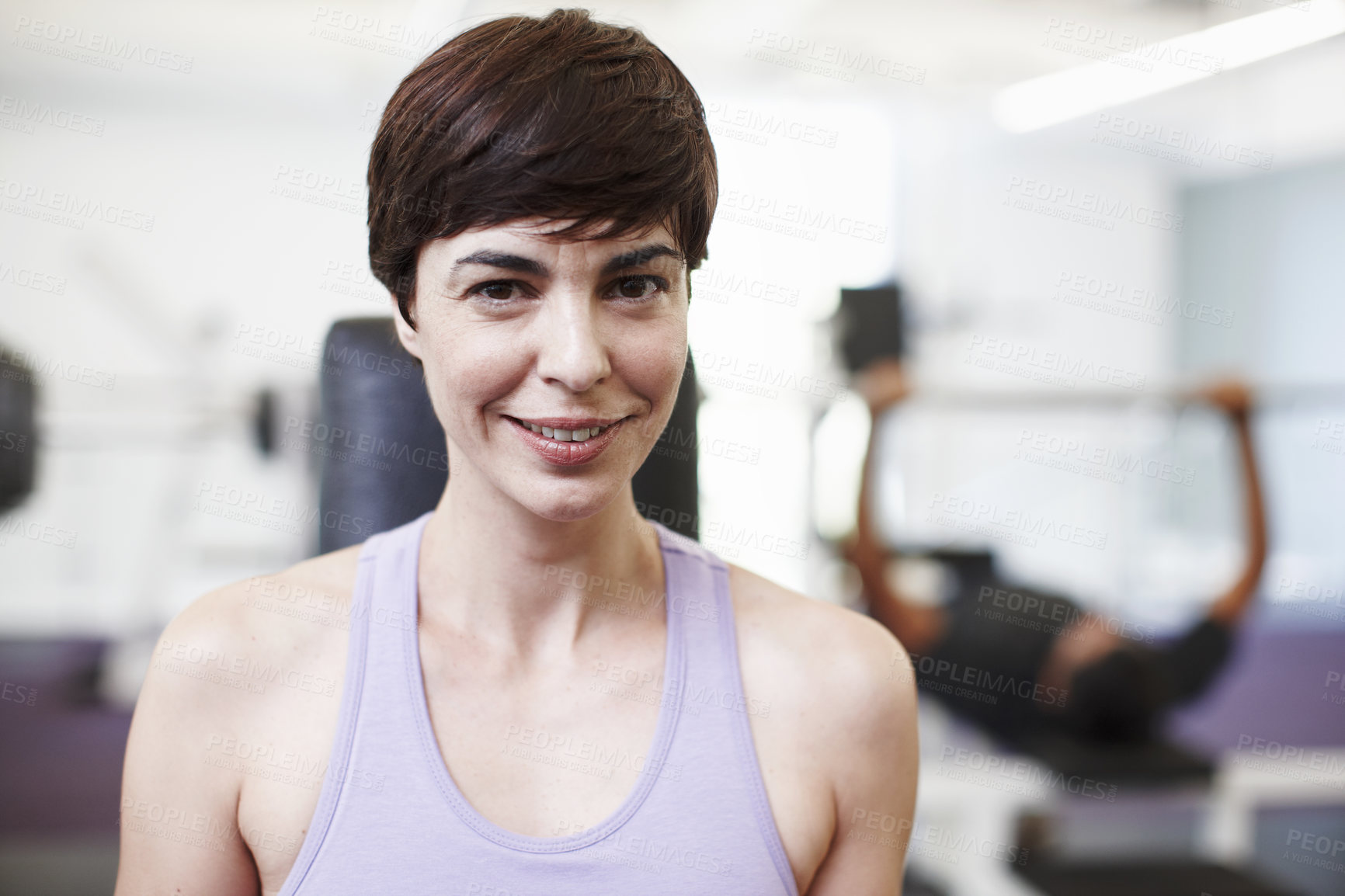 Buy stock photo Cropped portrait of an attractive young woman in the gym