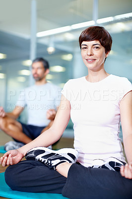 Buy stock photo Happy woman in lotus position with man in background