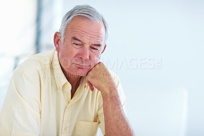 Buy stock photo Closeup of handsome mature man contemplating at home