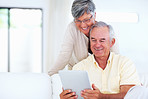 Mature couple using tablet PC