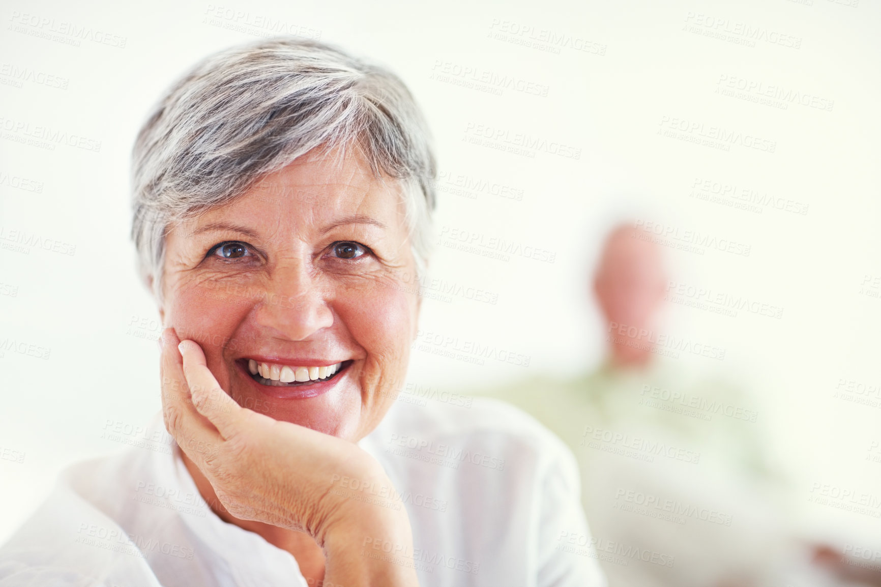 Buy stock photo Senior woman, face and smile for relax, confident and retirement on weekend in home with good health. Elderly person, portrait and happy for comfort, peace and break in living room with positive mood