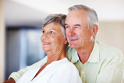 Buy stock photo Elderly couple, happy and hug in home for relax, bonding and love with support, care and romance. Senior people, smile and connection in apartment for weekend break, marriage and embrace with trust