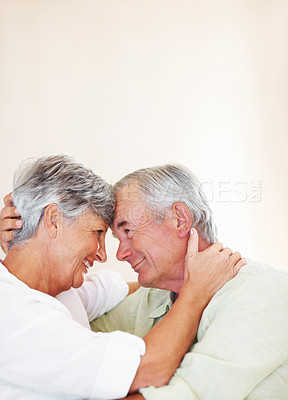 Buy stock photo Senior couple, love and romance in home for relax, bonding and happy with support, care and together. Elderly people, smile and connection in house for weekend break, marriage and embrace with trust