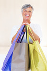Mature woman carrying shopping bags