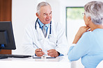 Doctor discussing medical report with female patient