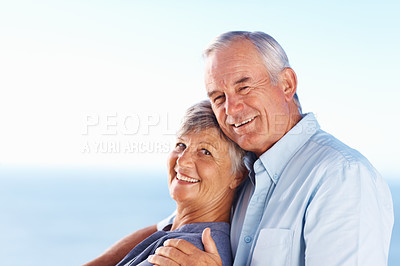 Buy stock photo Portrait of romantic mature couple smiling while spending quality time outdoors
