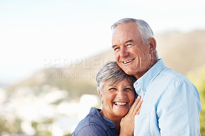 Buy stock photo Portrait of smiling mature woman leaning on man's chest with mountain in background