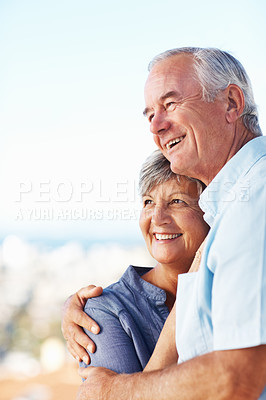 Buy stock photo Happy romantic couple embracing while spending time outdoors