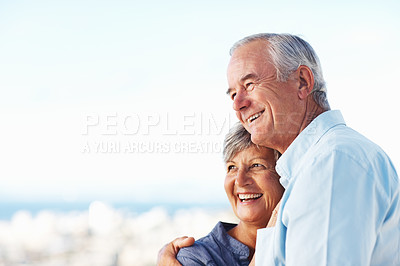Buy stock photo Closeup of handsome mature man and woman smiling while embracing outdoors