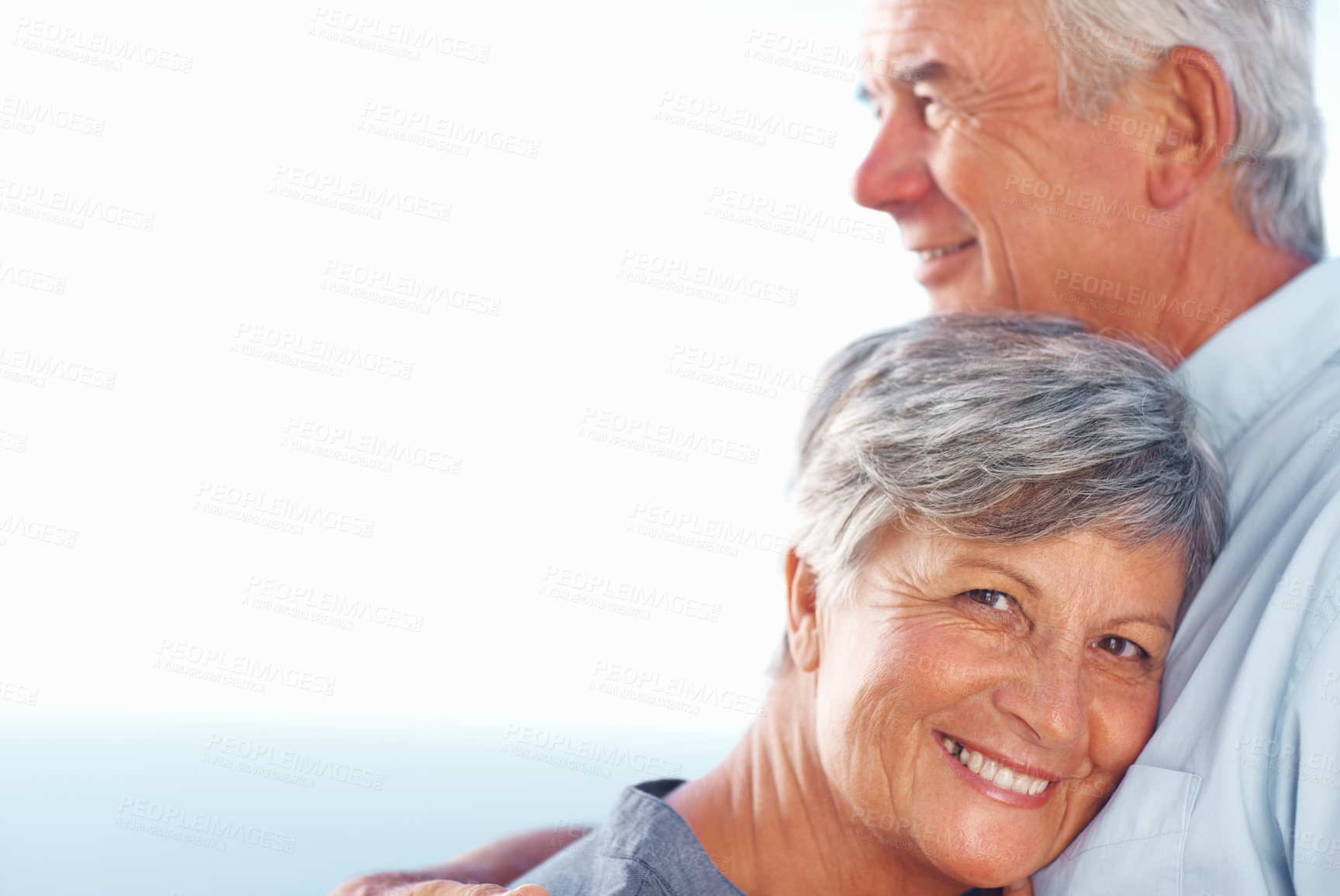 Buy stock photo Portrait of smiling mature woman leaning head against man's chest