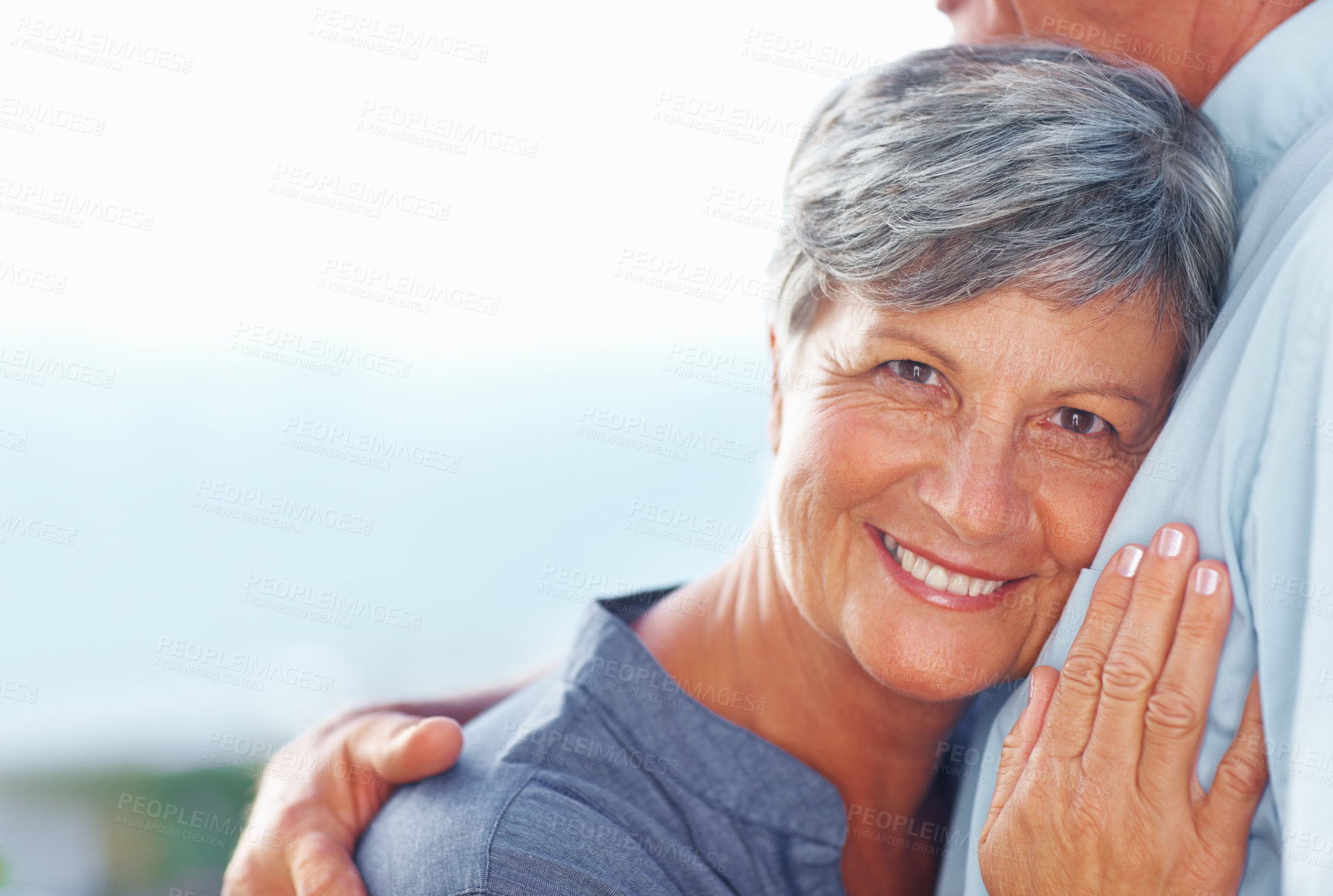 Buy stock photo Senior couple, smile and hug by sky for loyalty, connection or romantic relationship on vacation together. Man, woman and embrace outdoor for support, love or mockup space with partner on summer date