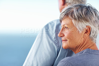 Buy stock photo Closeup of mature woman standing behind man while spending time outdoors