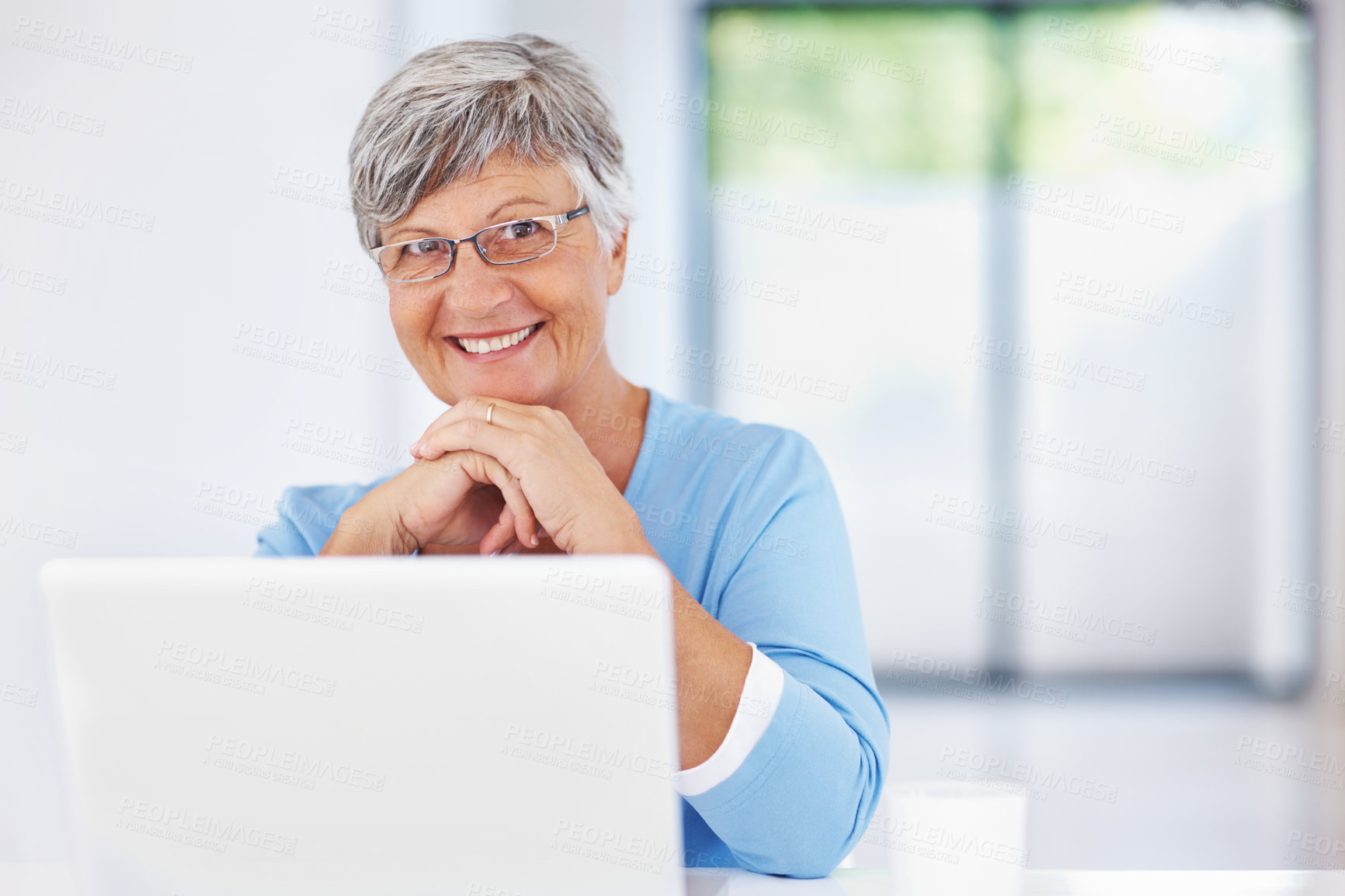 Buy stock photo Old woman, laptop and portrait in home for internet surfing, reading news article and online for blog. Female person, morning and relax in retirement with espresso, shopping search and browse website