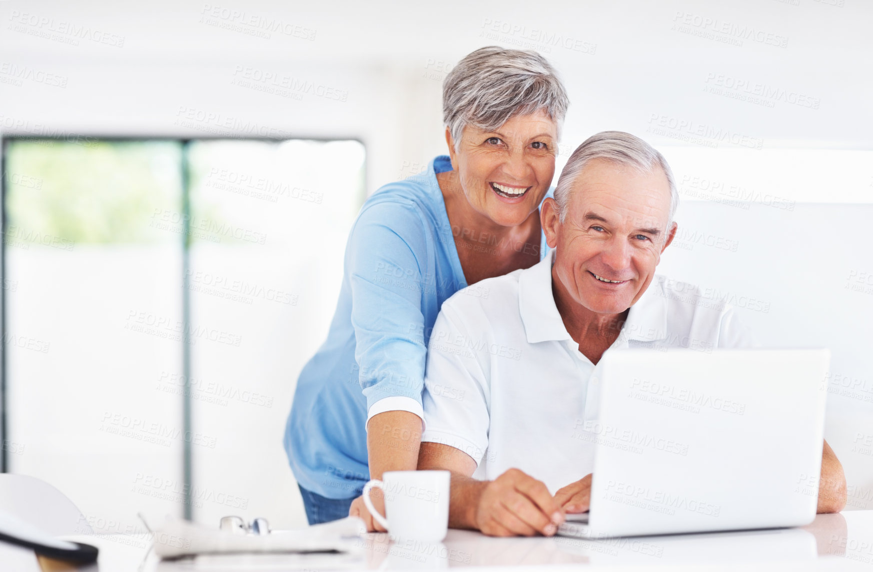 Buy stock photo Senior couple, laptop and portrait with smile, excited or care in morning, search or email in home. Elderly man, woman and computer in kitchen with notification, relax or happy with coffee in Germany