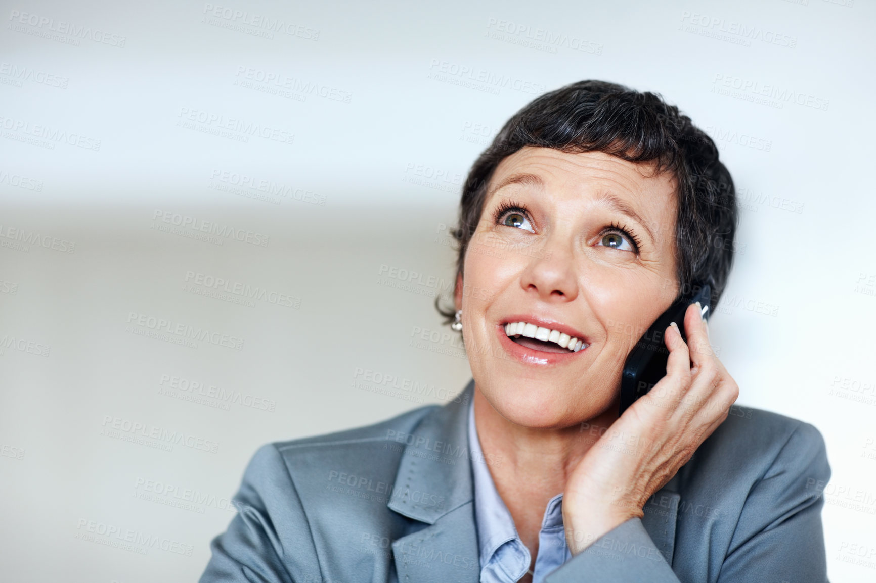 Buy stock photo Business, phone call and thinking with mature woman in office for communication or planning. Future, idea and vision with smile of confident employee person in workplace for professional networking