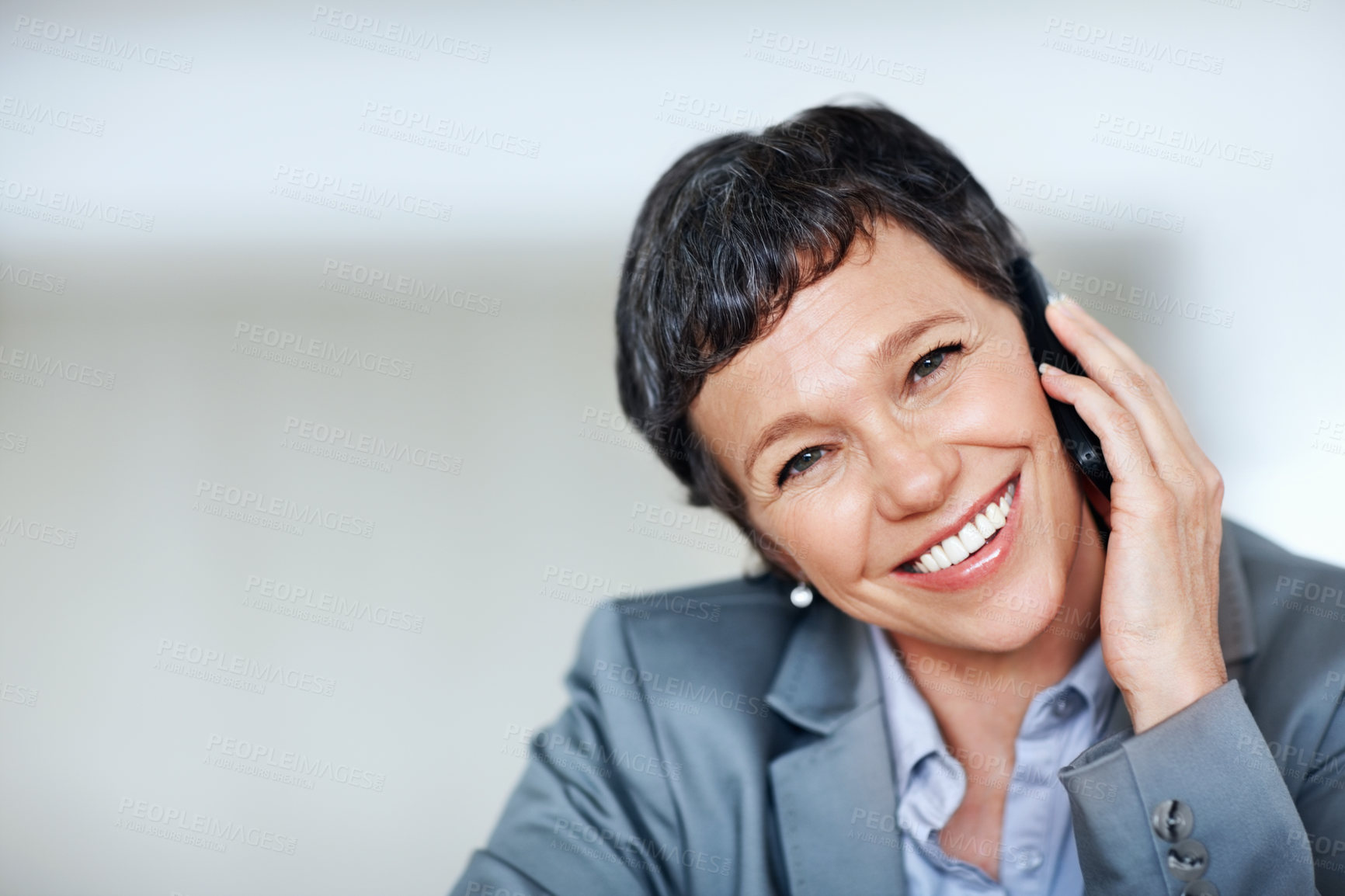 Buy stock photo Closeup of charming mature business woman smiling while using cellphone