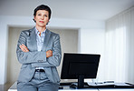 Business woman leaning on office desk