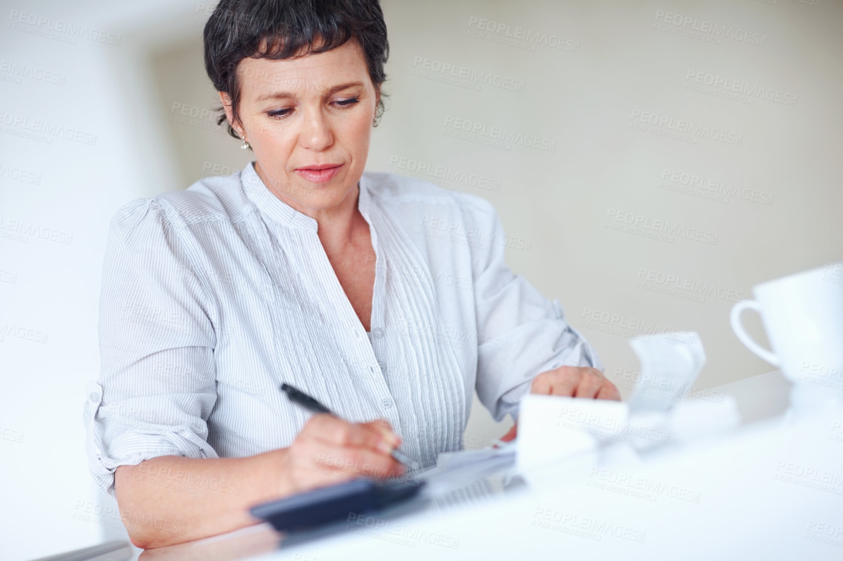 Buy stock photo Accountant, calculator and writing for business tax, finance administration and bookkeeping in office. Mature woman, receipt and audit for financial spreadsheet, profit report and accounting invoice