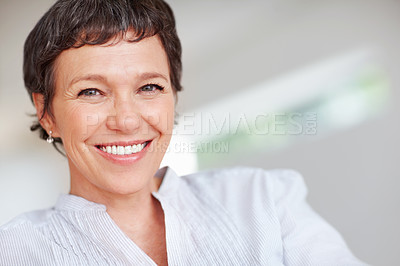 Buy stock photo Mature woman, happy and portrait in house or home to relax with pride in lounge and living room. Real estate agent, smile or face of confident realtor resting in France break, wellness or day off