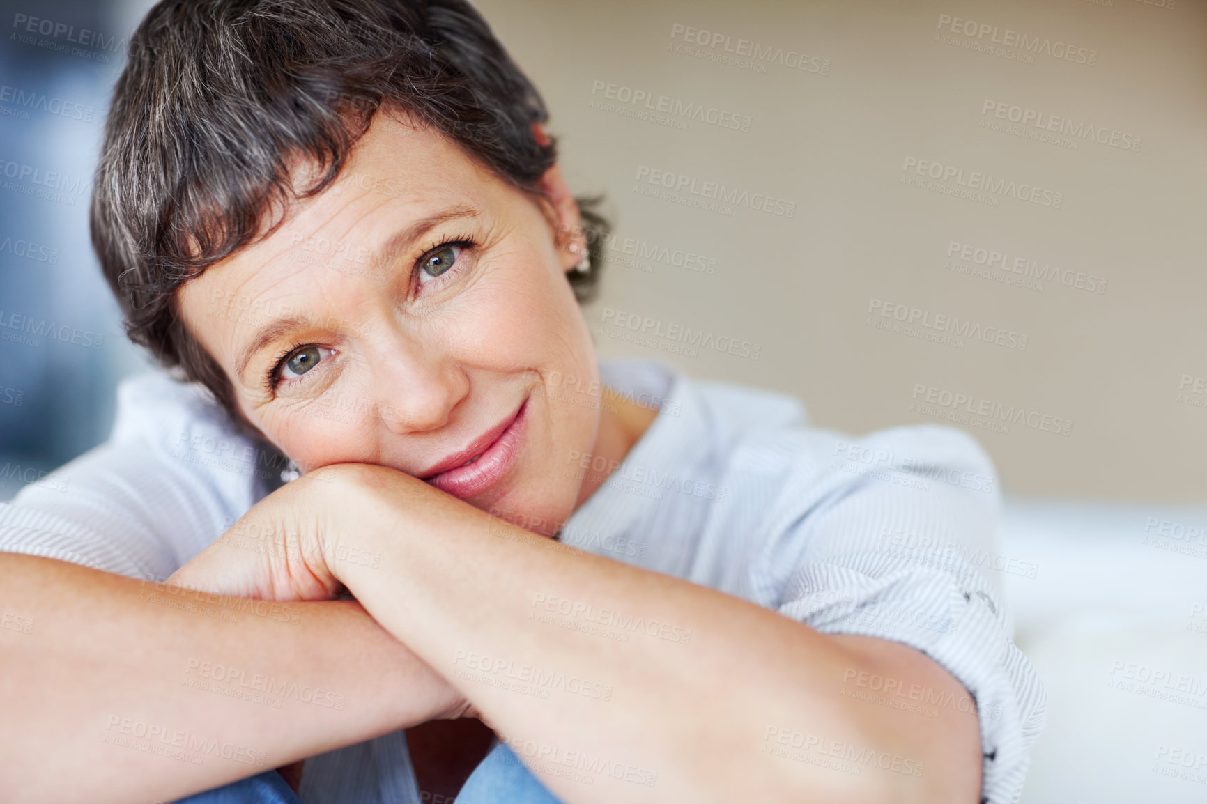 Buy stock photo Mature woman, peace and portrait in home on couch to relax with smile in lounge and living room. Introvert, sofa or face of female person resting in France for break, wellness or day off to chill