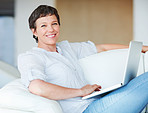 Business woman using laptop at home