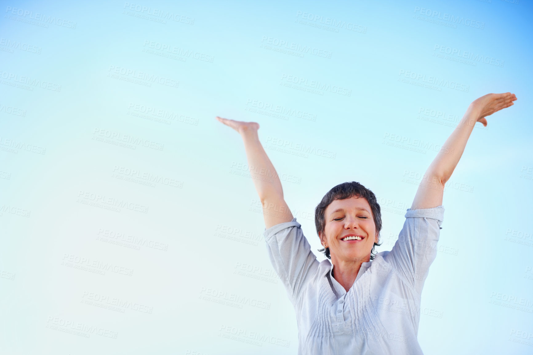 Buy stock photo Freedom, mature woman and smile for holiday, travel or vacation in retirement on blue sky. Arms up, mockup space and portrait with tourist cheer for outdoor summer with peace, sightseeing or wellness