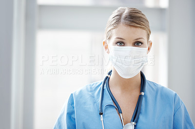 Buy stock photo Portrait of a young female surgeon wearing a surgical mask - copyspace