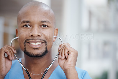 Buy stock photo Friendly African-American doctor smiling at the camera - copyspace