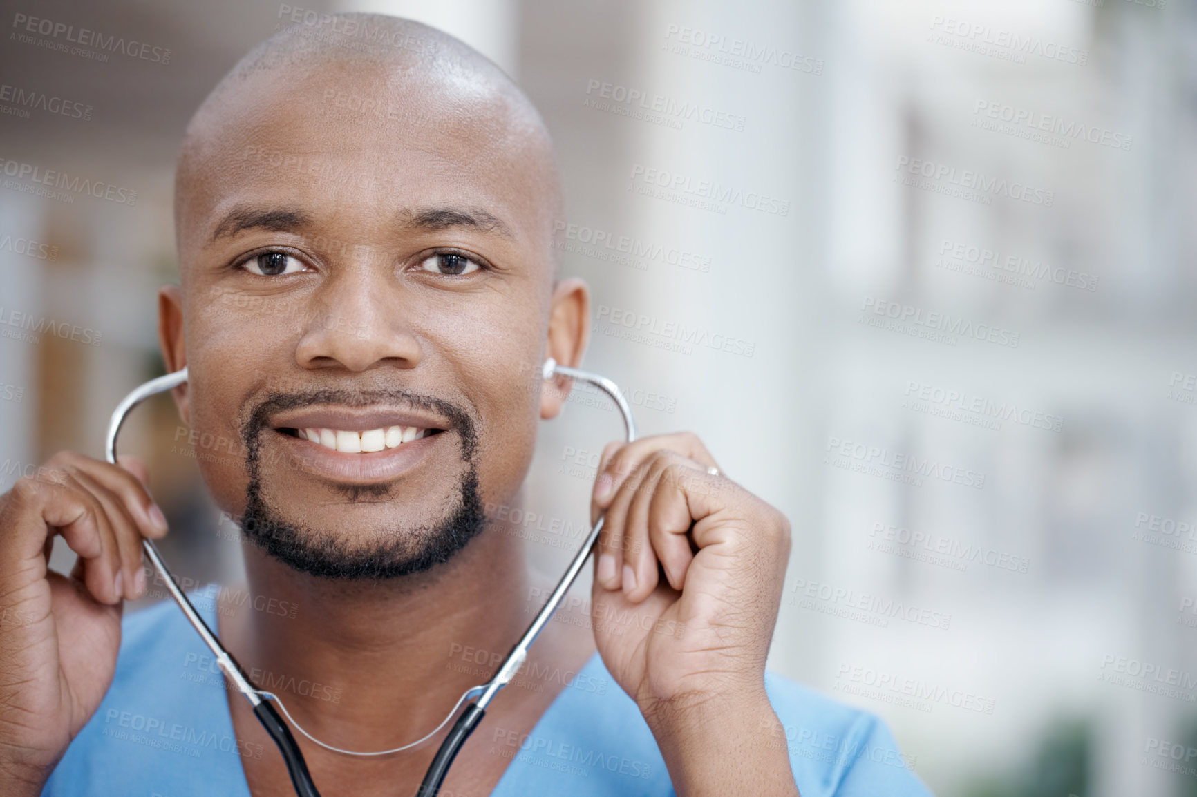 Buy stock photo Friendly African-American doctor smiling at the camera - copyspace