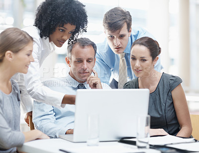 Buy stock photo Business people, coaching and pointing with laptop in meeting for project, research or corporate development at office. Young, group or employees with team on computer for collaboration at workplace