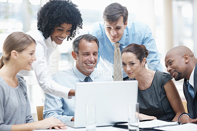 Buy stock photo Happy, business people and pointing with laptop in meeting for project, research or corporate development at office. Young, group or employees with team on computer for software or web at workplace