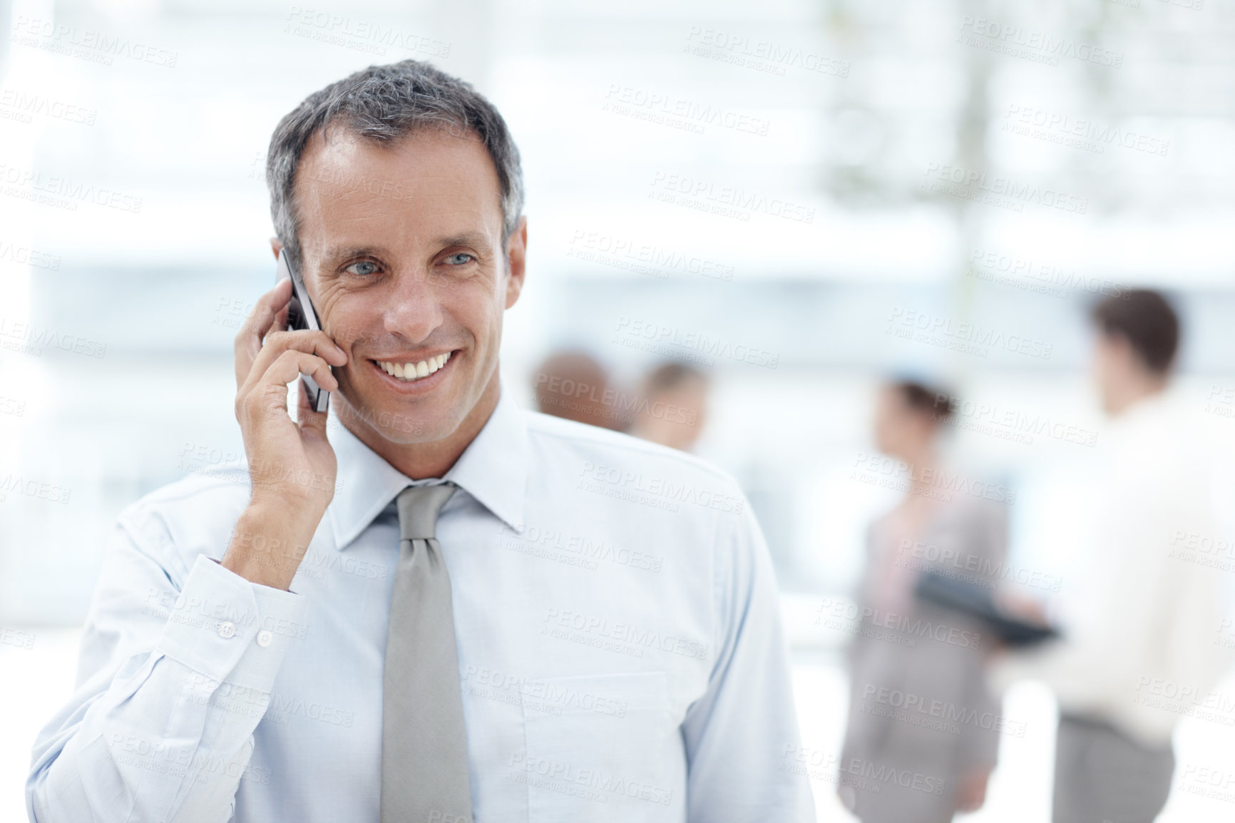 Buy stock photo Phone call, smile and businessman in office lobby for client, communication and b2b networking. Happy, corporate worker and career conversation with legal discussion, partnership and collaboration