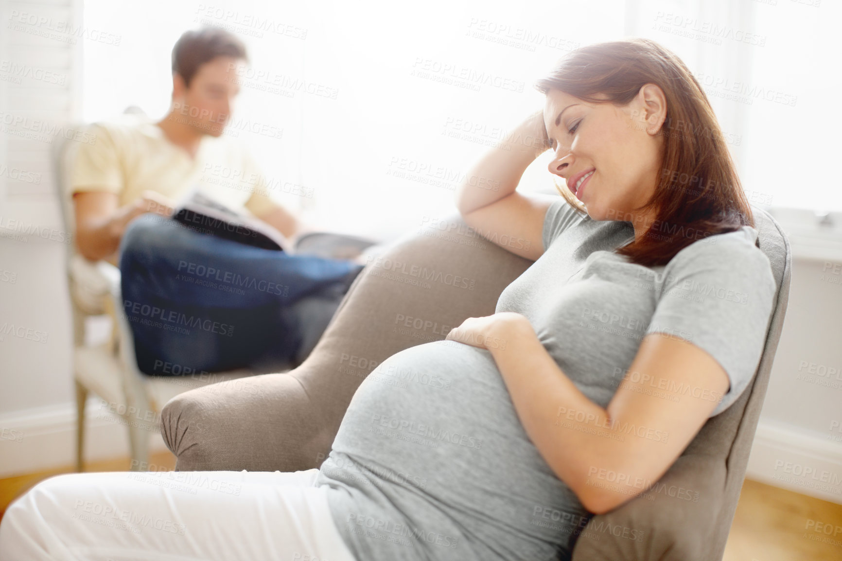 Buy stock photo Pregnant woman, thinking and rest in relax, happiness or comfort for baby development in family home. People, waiting and chair in motherhood as parents with growth for break, peace and calm in house