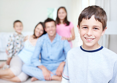 Buy stock photo Bedroom, morning or portrait of happy boy with family blur in home for support, love or wellness. Teenager, mom or dad with toddler, children or growth for bonding together with parents or siblings