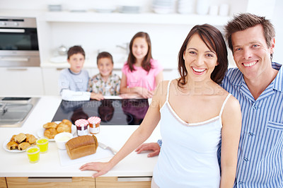 Buy stock photo Bonding, kitchen and portrait of children with parents in home for happiness, connection and family time. Smile, love and kid siblings with mother and father for care together at house in Germany.