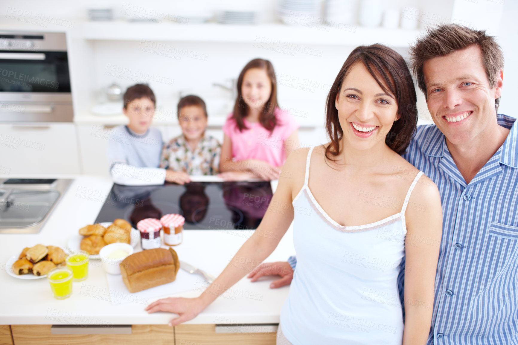 Buy stock photo Bonding, kitchen and portrait of children with parents in home for happiness, connection and family time. Smile, love and kid siblings with mother and father for care together at house in Germany.