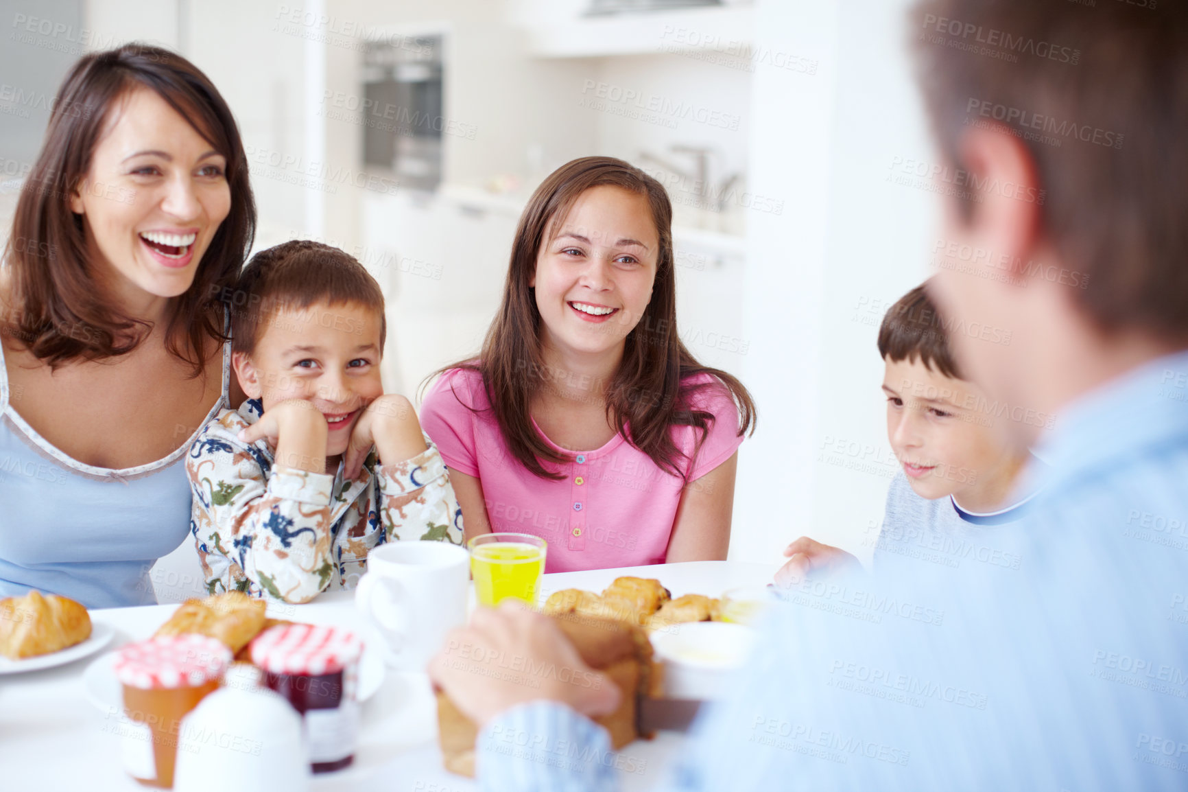 Buy stock photo Eating breakfast, happy family and relax in home for nutrition, healthy diet and growth. Morning food, mother and father with kids bonding together, laughing and hungry parents talking in dining room