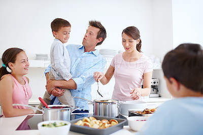 Buy stock photo Family, happy and cooking in kitchen with love, Thanksgiving celebration and support. Parents, children and excited in home for meal preparation, nutritional lunch and smile in apartment for learning