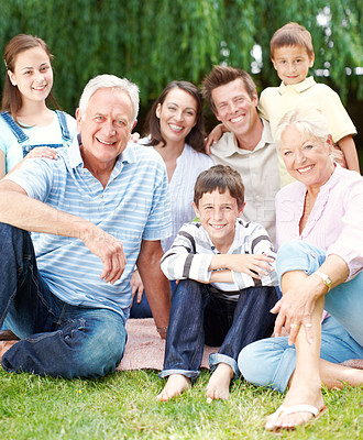 Buy stock photo Happy, portrait and big family with generations in nature for holiday, weekend or bonding together. Grandparents, parents and children or kids with smile in joy for picnic or outdoor vacation at park