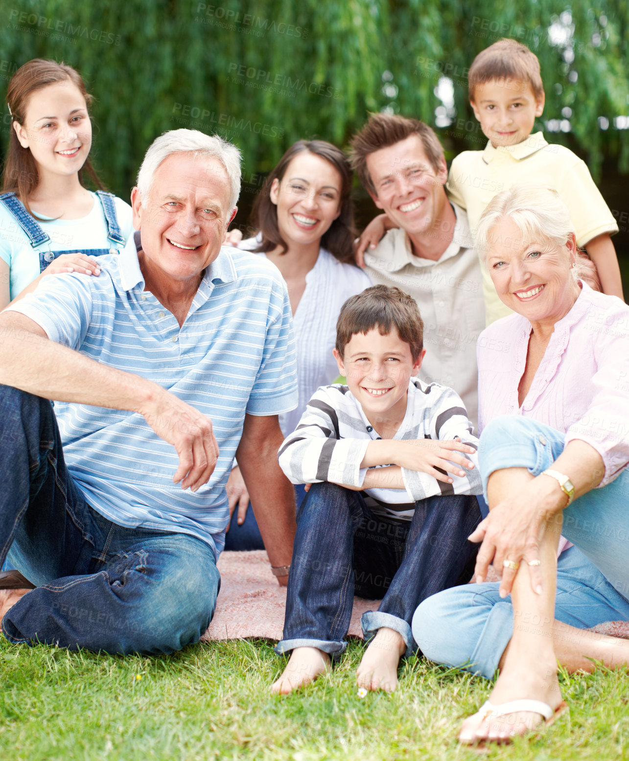 Buy stock photo Happy, portrait and big family with generations in nature for holiday, weekend or bonding together. Grandparents, parents and children or kids with smile in joy for picnic or outdoor vacation at park