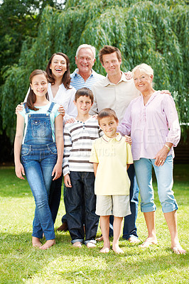 Buy stock photo Happy, portrait or big family with hug in nature for holiday, weekend or bonding together. Grandparents, parents and children or kids with smile or generations for outdoor vacation or support at park