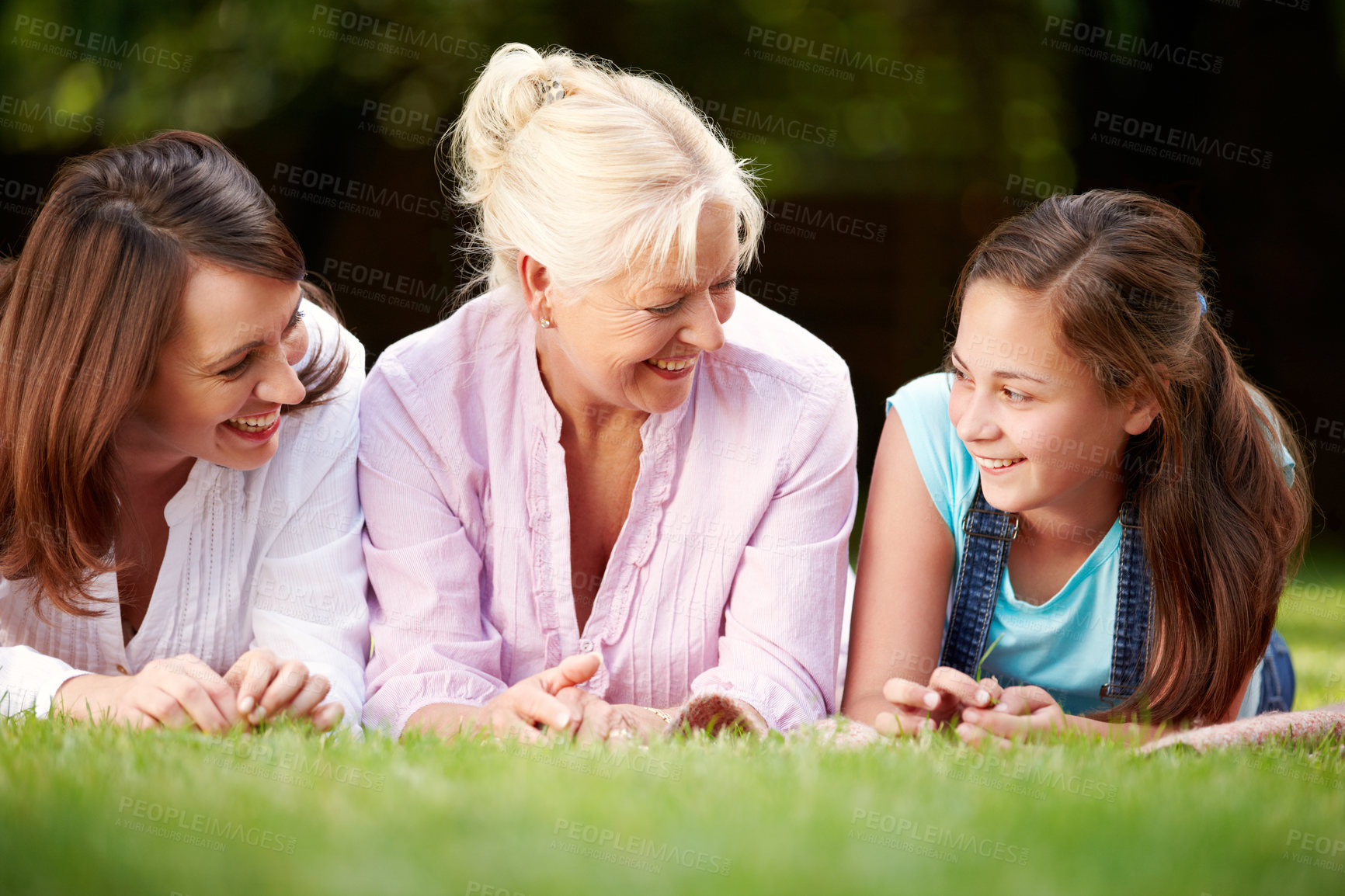 Buy stock photo Park, grandparent and mom with child for laugh, connection and bonding together as generations. Happy family, girl and women for motherhood with smile, security or love embrace on holiday in Sydney