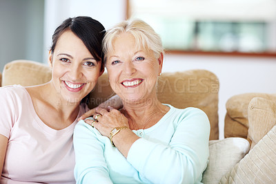 Buy stock photo Happy, women and portrait of family, senior mother and daughter with smile in home with bonding. Generations, care and weekend on living room couch with hug, support and love in lounge with embrace 