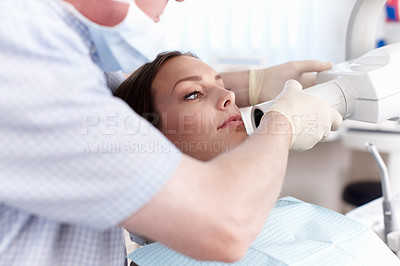 Buy stock photo Portrait of female patient going through dental treatment in clinic