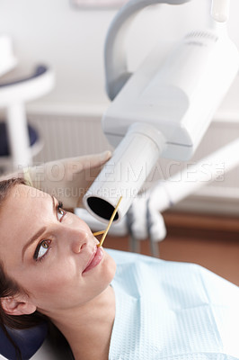 Buy stock photo Girl, mouth and inspection with equipment at dentist for oral cleaning, teeth whitening and dental treatment. Woman, technology and assessment with transformation, hygiene scan and medical procedure